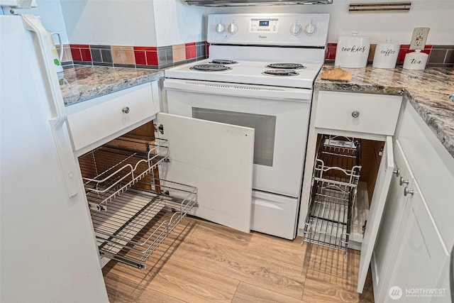 411 N 90th St Unit 406, Seattle, WA 98103 - kitchen with white appliances, white cabinetry, and light wood-style flooring