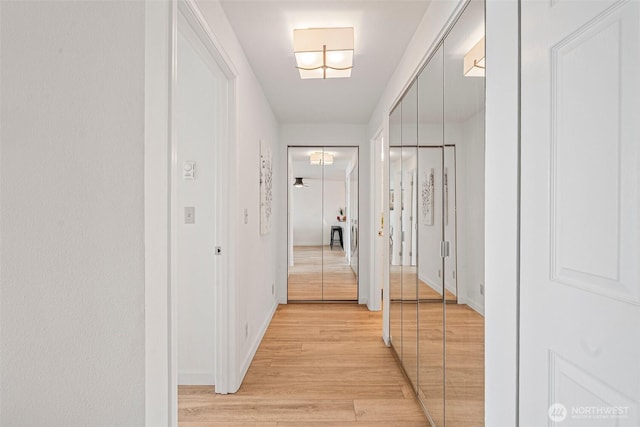 411 N 90th St Unit 406, Seattle, WA 98103 - hallway featuring light wood-style floors and baseboards