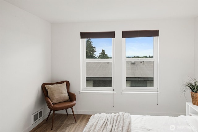 411 N 90th St Unit 406, Seattle, WA 98103 - bedroom featuring wood finished floors and baseboards