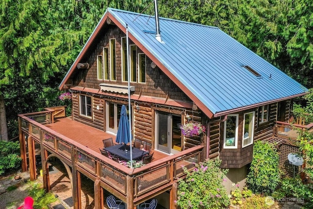 793 E Stadium Beach Rd W, Grapeview, WA 98546 - rear view of property with a standing seam roof, a deck, and a metal roof
