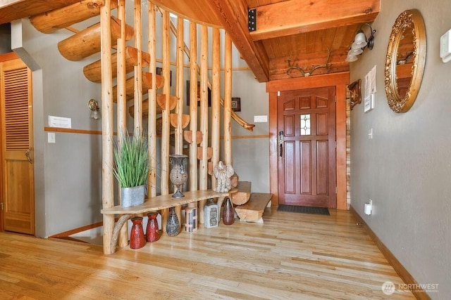 793 E Stadium Beach Rd W, Grapeview, WA 98546 - entryway with wood finished floors and a wooden ceiling with exposed beams
