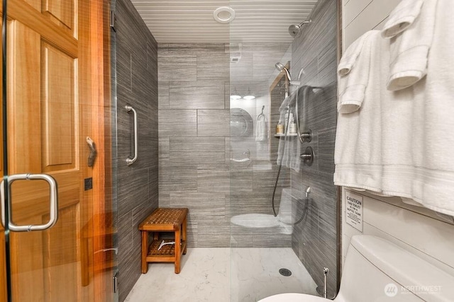 793 E Stadium Beach Rd W, Grapeview, WA 98546 - full bathroom featuring marble look tiles and a shower stall