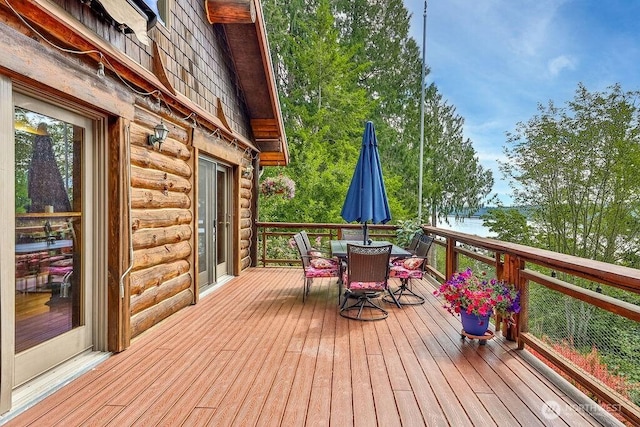 793 E Stadium Beach Rd W, Grapeview, WA 98546 - wooden deck featuring outdoor dining space and a water view