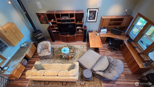 755 Ferry Rd, Lopez Island, WA 98261 - living room featuring wood finished floors, a wood stove, and built in desk