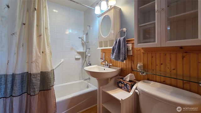 755 Ferry Rd, Lopez Island, WA 98261 - bathroom featuring shower / bath combo and wainscoting