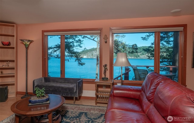 755 Ferry Rd, Lopez Island, WA 98261 - living area with plenty of natural light, wood finished floors, and a water view