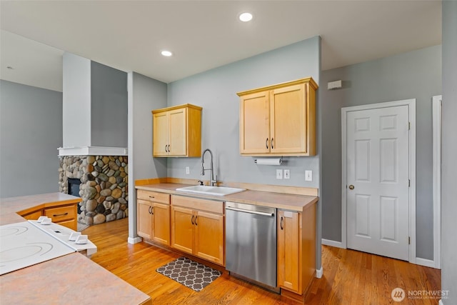 321 Range View Rd, Ellensburg, WA 98926 - kitchen with dishwasher, light wood-type flooring, light countertops, recessed lighting, and a stone fireplace