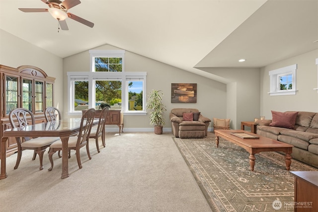 1605 Donovan Ave, Bellingham, WA 98225 - living room featuring light colored carpet, vaulted ceiling, healthy amount of natural light, and a ceiling fan