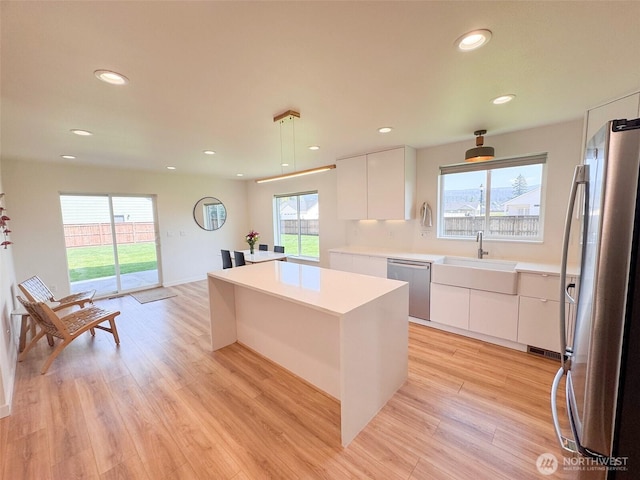 200 W Oak St, Yacolt, WA 98675 - kitchen with appliances with stainless steel finishes, modern cabinets, a kitchen island, white cabinets, and recessed lighting