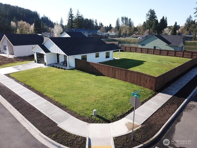 200 W Oak St, Yacolt, WA 98675 - view of yard featuring a garage, driveway, and a residential view