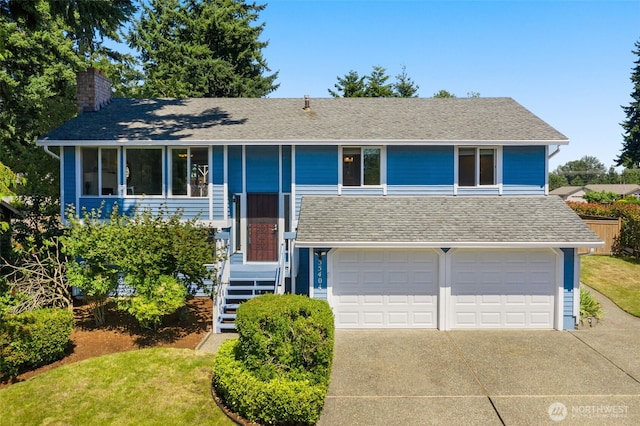 35404 18th Ave SW, Federal Way, WA 99023 - raised ranch with a chimney, driveway, a garage, a shingled roof, and a front yard
