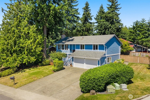 35404 18th Ave SW, Federal Way, WA 99023 - view of front of house with an attached garage, driveway, a chimney, stairway, and a shingled roof