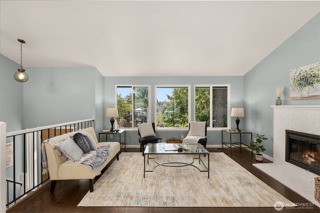 35404 18th Ave SW, Federal Way, WA 99023 - living area with wood finished floors, a brick fireplace, and vaulted ceiling