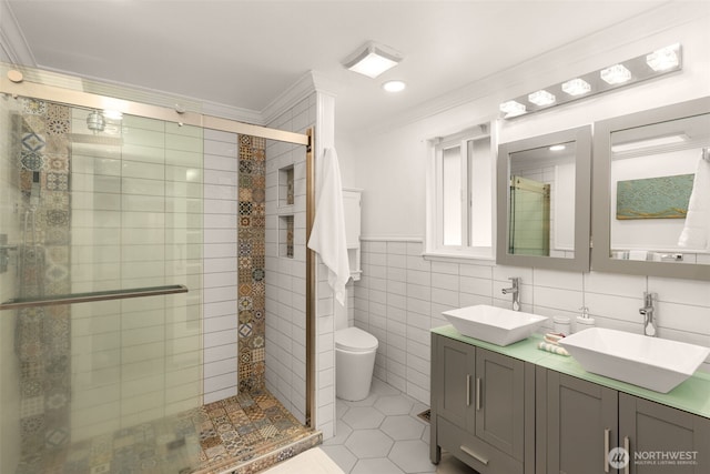 35404 18th Ave SW, Federal Way, WA 99023 - full bathroom with crown molding, double vanity, a stall shower, tile walls, and tile patterned flooring