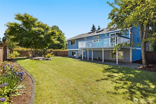 35404 18th Ave SW, Federal Way, WA 99023 - back of property with a deck, stairs, and a fenced backyard