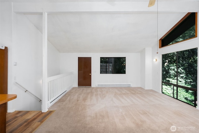 6 Hillside Pl, Bellingham, WA 98229 - unfurnished living room featuring baseboard heating, lofted ceiling, and carpet