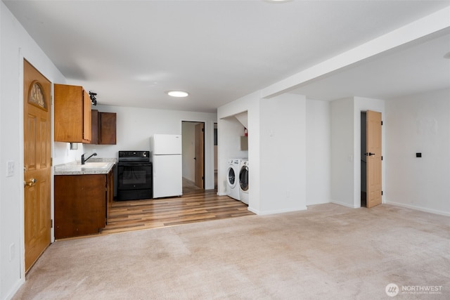 6 Hillside Pl, Bellingham, WA 98229 - kitchen featuring freestanding refrigerator, separate washer and dryer, range, light carpet, and light countertops