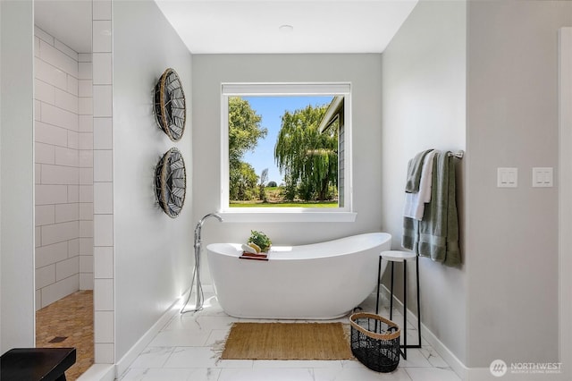 10391 Rd 5.6 NE, Moses Lake, WA 98837 - bathroom with marble look tile flooring, a freestanding tub, and a walk in shower