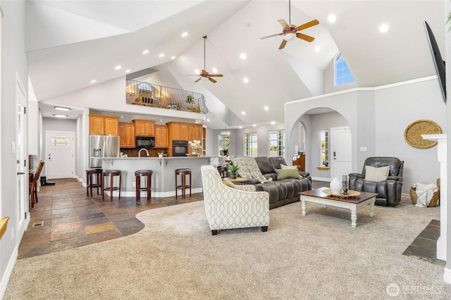 10391 Rd 5.6 NE, Moses Lake, WA 98837 - living area featuring ceiling fan, high vaulted ceiling, recessed lighting, stone tile flooring, and arched walkways