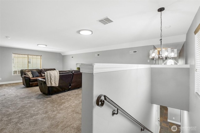 10391 Rd 5.6 NE, Moses Lake, WA 98837 - hallway featuring an upstairs landing, carpet, and a chandelier