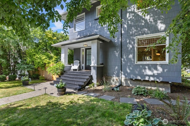 2159 10th Ave W, Seattle, WA 98119 - view of front facade with a porch and a front lawn