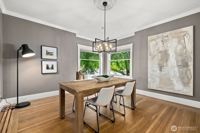 2159 10th Ave W, Seattle, WA 98119 - dining space with wood finished floors, a chandelier, and ornamental molding