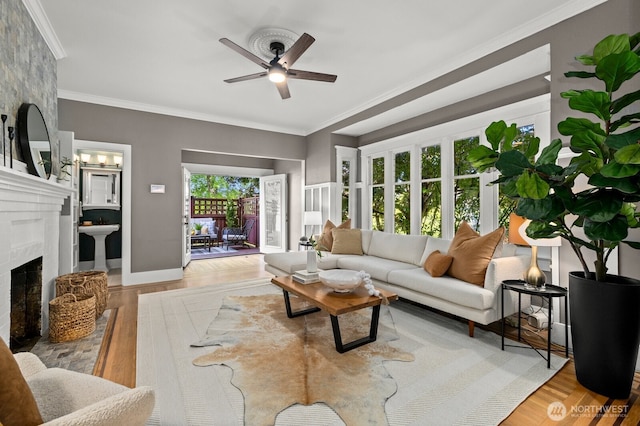 2159 10th Ave W, Seattle, WA 98119 - living area with a ceiling fan, crown molding, and a fireplace