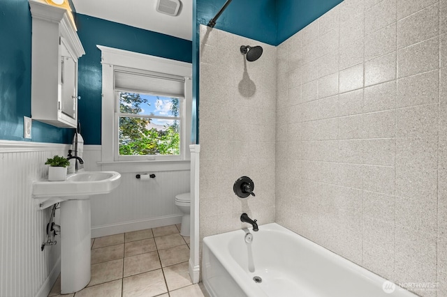 2159 10th Ave W, Seattle, WA 98119 - full bathroom featuring shower / tub combination, tile patterned flooring, and wainscoting