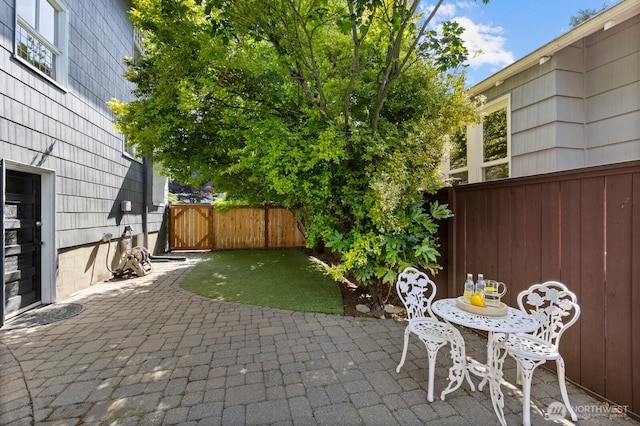 2159 10th Ave W, Seattle, WA 98119 - fenced backyard featuring a patio area