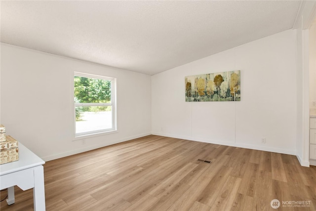 36715 Allen Rd S, Roy, WA 98580 - unfurnished bedroom with light wood-style floors and vaulted ceiling