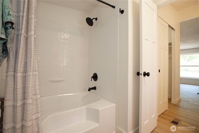 36715 Allen Rd S, Roy, WA 98580 - full bathroom featuring shower / bath combination with curtain and wood finished floors