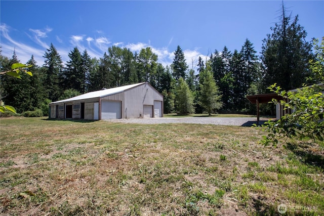 36715 Allen Rd S, Roy, WA 98580 - view of green lawn with a detached garage and an outdoor structure
