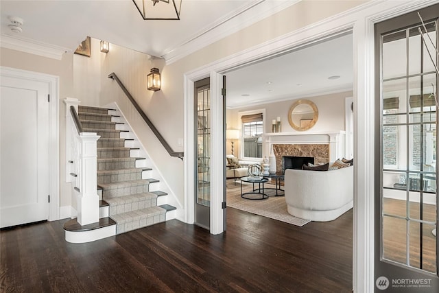 1631 Interlaken Pl E, Seattle, WA 98112 - foyer featuring wood finished floors, crown molding, stairs, and a fireplace