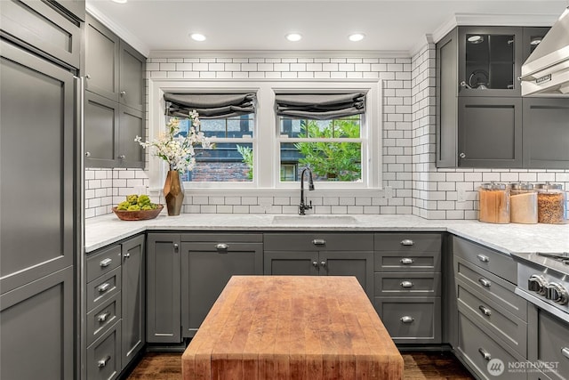 1631 Interlaken Pl E, Seattle, WA 98112 - kitchen with gray cabinetry, wall chimney exhaust hood, wooden counters, and ornamental molding