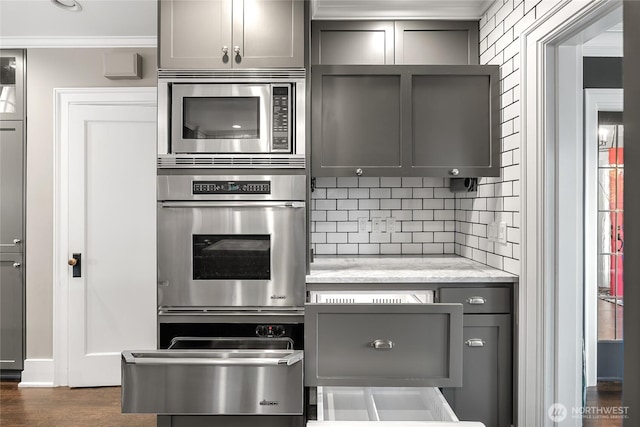 1631 Interlaken Pl E, Seattle, WA 98112 - kitchen featuring stainless steel appliances, gray cabinetry, backsplash, a warming drawer, and dark wood-style flooring