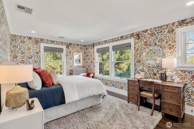 1631 Interlaken Pl E, Seattle, WA 98112 - bedroom featuring wallpapered walls, ornamental molding, wood finished floors, radiator, and recessed lighting