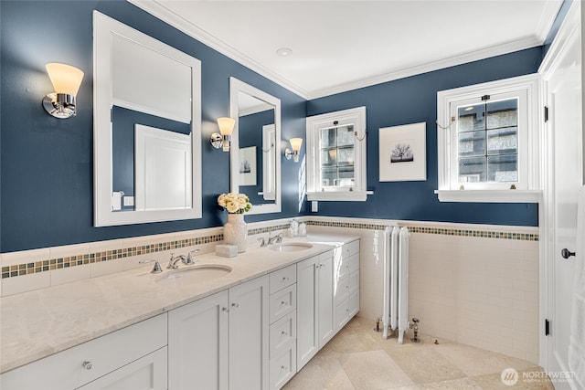 1631 Interlaken Pl E, Seattle, WA 98112 - full bath featuring double vanity, tile walls, ornamental molding, tile patterned flooring, and wainscoting