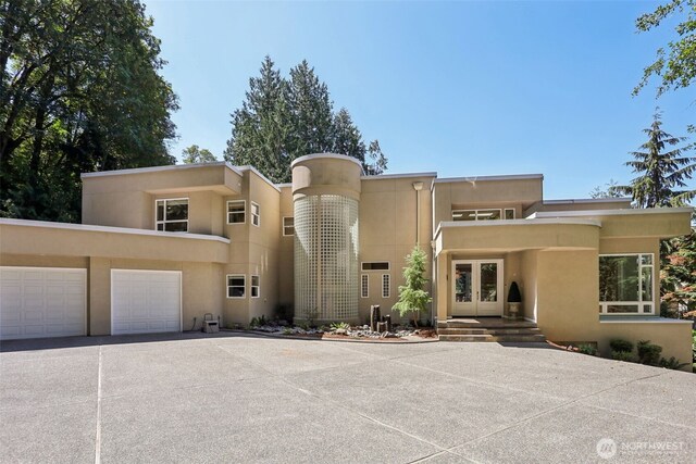 1706 205th Pl NE, Sammamish, WA 98074 - art deco home featuring french doors, stucco siding, and concrete driveway