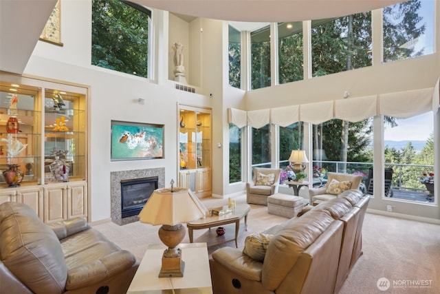 1706 205th Pl NE, Sammamish, WA 98074 - living room featuring carpet flooring, a high ceiling, and a high end fireplace