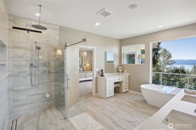 1706 205th Pl NE, Sammamish, WA 98074 - bathroom featuring double vanity, a shower stall, ensuite bath, a freestanding bath, and recessed lighting