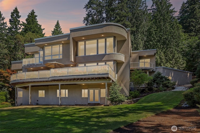 1706 205th Pl NE, Sammamish, WA 98074 - back of property featuring a balcony, a yard, and stucco siding