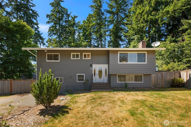 20101 95th Pl NE, Bothell, WA 98011 - bi-level home featuring entry steps, a chimney, and a fenced backyard