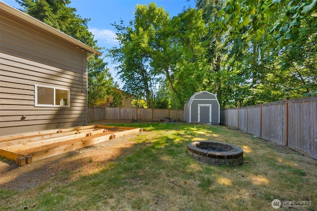 20101 95th Pl NE, Bothell, WA 98011 - fenced backyard with a fire pit, a shed, and a vegetable garden
