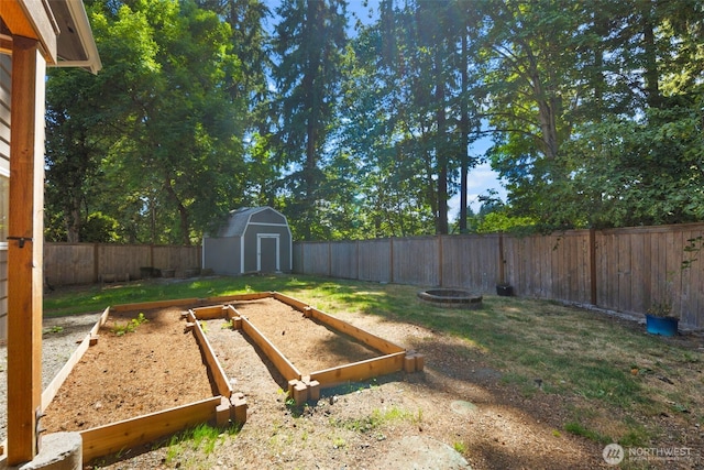 20101 95th Pl NE, Bothell, WA 98011 - fenced backyard with a garden and a storage unit