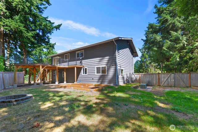 20101 95th Pl NE, Bothell, WA 98011 - rear view of house featuring a fire pit, a fenced backyard, a wooden deck, and stairway