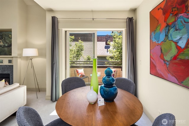2035 Eastlake Ave E Unit 301, Seattle, WA 98102 - carpeted dining area featuring a lit fireplace and baseboards