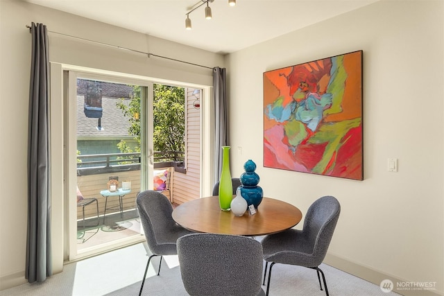2035 Eastlake Ave E Unit 301, Seattle, WA 98102 - carpeted dining space featuring baseboards