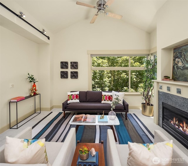 2035 Eastlake Ave E Unit 301, Seattle, WA 98102 - living room with lofted ceiling, a glass covered fireplace, ceiling fan, and carpet flooring