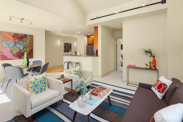 2035 Eastlake Ave E Unit 301, Seattle, WA 98102 - living area featuring track lighting, light colored carpet, and lofted ceiling