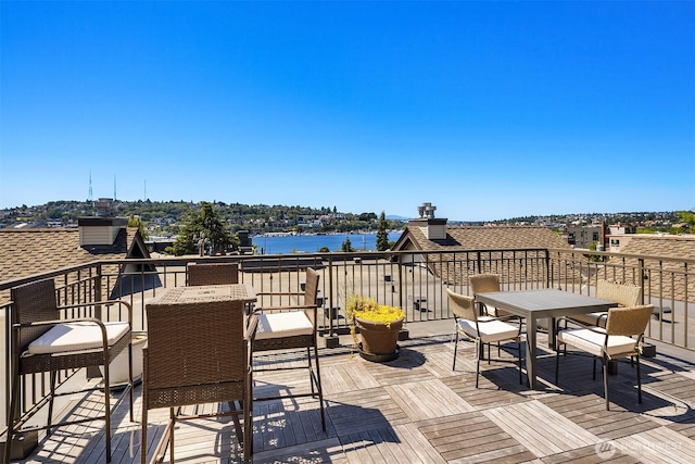 2035 Eastlake Ave E Unit 301, Seattle, WA 98102 - wooden deck featuring a water view and outdoor dining area